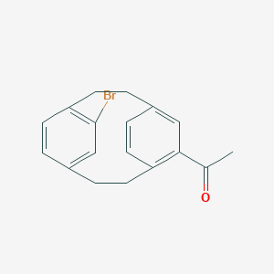 1-(11-Bromo-5-tricyclo[8.2.2.24,7]hexadeca-1(12),4,6,10,13,15-hexaenyl)ethanone