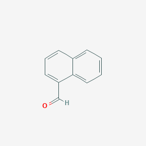 B104281 1-Naphthaldehyde CAS No. 66-77-3