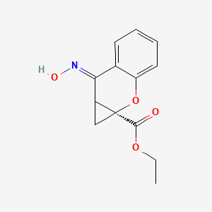 molecular formula C13H13NO4 B10763574 ethyl (1aS,7E)-7-hydroxyimino-1,7a-dihydrocyclopropa[b]chromene-1a-carboxylate 