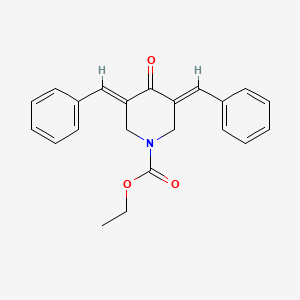 molecular formula C22H21NO3 B10778822 1-Piperidinecarboxylic acid, 4-oxo-3,5-bis(phenyl-methylene)-, ethyl ester 
