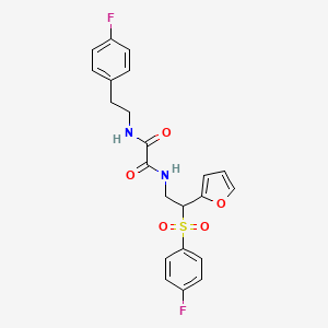 molecular formula C22H20F2N2O5S B11250993 N-[2-(4-fluorobenzenesulfonyl)-2-(furan-2-yl)ethyl]-N'-[2-(4-fluorophenyl)ethyl]ethanediamide 