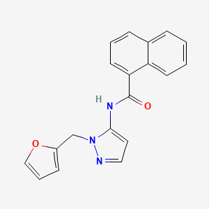 molecular formula C19H15N3O2 B11305732 N-[1-(furan-2-ylmethyl)-1H-pyrazol-5-yl]naphthalene-1-carboxamide 