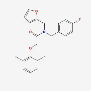molecular formula C23H24FNO3 B11374508 N-(4-fluorobenzyl)-N-(furan-2-ylmethyl)-2-(2,4,6-trimethylphenoxy)acetamide 