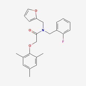 molecular formula C23H24FNO3 B11375351 N-(2-fluorobenzyl)-N-(furan-2-ylmethyl)-2-(2,4,6-trimethylphenoxy)acetamide 