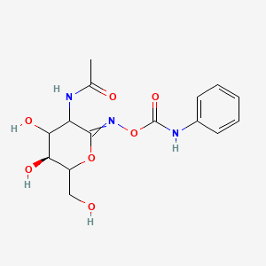 [[(5S)-3-Acetamido-4,5-dihydroxy-6-(hydroxymethyl)oxan-2-ylidene]amino] N-phenylcarbamate