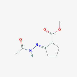 Cyclopentanecarboxylic acid, 2-(acetylhydrazono)-, methyl ester, (E)-(9CI)