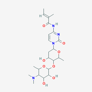 molecular formula C23H36N4O8 B116111 (E)-N-[1-[5-[5-(dimethylamino)-3,4-dihydroxy-6-methyloxan-2-yl]oxy-4-hydroxy-6-methyloxan-2-yl]-2-oxopyrimidin-4-yl]-2-methylbut-2-enamide CAS No. 157878-05-2
