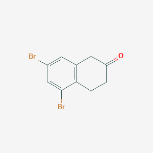 B117721 5,7-Dibromo-2-tetralone CAS No. 144066-44-4