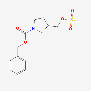 molecular formula C14H19NO5S B11824982 Benzyl 3-(((methylsulfonyl)oxy)methyl)pyrrolidine-1-carboxylate 