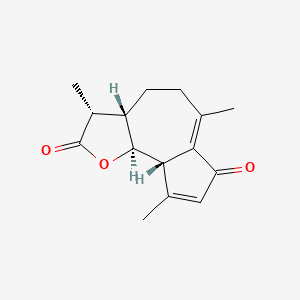 molecular formula C15H18O3 B1194218 (3R,3aS,9aS,9bS)-3,6,9-trimethyl-3,3a,4,5,9a,9b-hexahydroazuleno[4,5-b]furan-2,7-dione 
