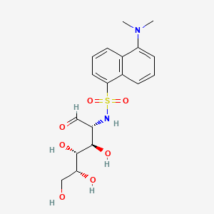 molecular formula C18H24N2O7S B1207675 5-(dimethylamino)-N-[(2R,3R,4R,5R)-3,4,5,6-tetrahydroxy-1-oxohexan-2-yl]naphthalene-1-sulfonamide CAS No. 78617-03-5