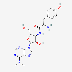 molecular formula C21H27N7O5 B1208768 2-amino-N-[(2S,3S,4R,5R)-5-[6-(dimethylamino)purin-9-yl]-4-hydroxy-2-(hydroxymethyl)oxolan-3-yl]-3-(4-hydroxyphenyl)propanamide CAS No. 21708-87-2