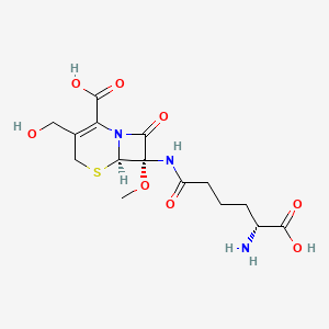 molecular formula C15H21N3O8S B1214814 (6R,7S)-7-[[(5R)-5-amino-5-carboxypentanoyl]amino]-3-(hydroxymethyl)-7-methoxy-8-oxo-5-thia-1-azabicyclo[4.2.0]oct-2-ene-2-carboxylic acid CAS No. 58301-37-4