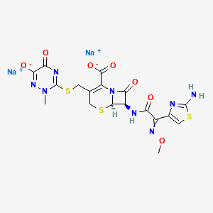 molecular formula C18H16N8Na2O7S3 B1217605 disodium;(6R,7R)-7-[[2-(2-amino-1,3-thiazol-4-yl)-2-methoxyiminoacetyl]amino]-3-[(2-methyl-6-oxido-5-oxo-1,2,4-triazin-3-yl)sulfanylmethyl]-8-oxo-5-thia-1-azabicyclo[4.2.0]oct-2-ene-2-carboxylate 