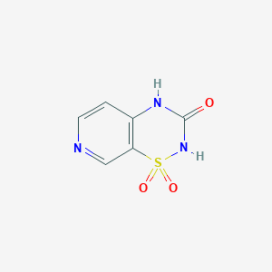 molecular formula C6H5N3O3S B121990 1,1-dioxo-4H-pyrido[4,3-e][1,2,4]thiadiazin-3-one CAS No. 152382-59-7
