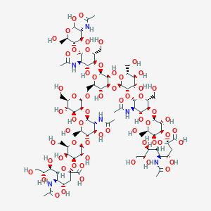 molecular formula C84H138N6O62 B122385 Neu5Ac(2->3)Gal(1->4)GlcNAc(1->2) Man(1->3)Neu5Ac(2->3)Gal(1->4)GlcNAc(1->2)Man(1->6)Man(1->4)GlcNAc(1->4)GlcNAc CAS No. 145211-77-4