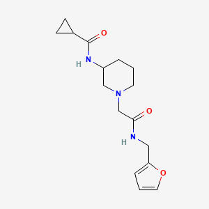 molecular formula C16H23N3O3 B12252627 N-[1-({[(furan-2-yl)methyl]carbamoyl}methyl)piperidin-3-yl]cyclopropanecarboxamide 