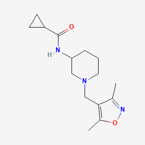 molecular formula C15H23N3O2 B12257979 N-{1-[(3,5-dimethyl-1,2-oxazol-4-yl)methyl]piperidin-3-yl}cyclopropanecarboxamide 
