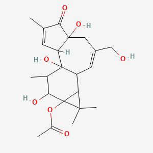 molecular formula C22H30O7 B12318093 5H-Cyclopropa[3,4]benz[1,2-e]azulen-5-one, 9a-(acetyloxy)-1,1a,1b,4,4a,7a,7b,8,9,9a-decahydro-4a,7b,9-trihydroxy-3-(hydroxymethyl)-1,1,6,8-tetramethyl-, [1aR-(1aalpha,1bbeta,4abeta,7aalpha,7balpha,8alpha,9beta,9aalpha)]- 