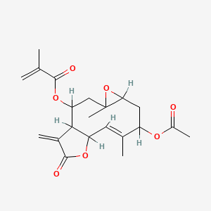 molecular formula C21H26O7 B1232444 [(9E)-8-Acetyloxy-4,9-dimethyl-14-methylidene-13-oxo-5,12-dioxatricyclo[9.3.0.04,6]tetradec-9-en-2-yl] 2-methylprop-2-enoate CAS No. 27542-23-0