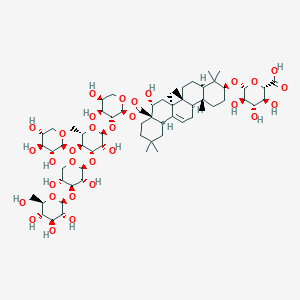 molecular formula C63H100O31 B1246021 (2S,3S,4S,5R,6R)-6-[[(3S,4aR,6aR,6bS,8R,8aR,12aS,14aR,14bR)-8a-[(2S,3R,4S,5S)-3-[(2S,3R,4S,5S,6S)-4-[(2S,3R,4S,5R)-3,5-dihydroxy-4-[(2S,3R,4S,5S,6R)-3,4,5-trihydroxy-6-(hydroxymethyl)oxan-2-yl]oxyoxan-2-yl]oxy-3-hydroxy-6-methyl-5-[(2S,3R,4S,5R)-3,4,5-trihydroxyoxan-2-yl]oxyoxan-2-yl]oxy-4,5-dihydroxyoxan-2-yl]oxycarbonyl-8-hydroxy-4,4,6a,6b,11,11,14b-heptamethyl-1,2,3,4a,5,6,7,8,9,10,12,12a,14,14a-tetradecahydropicen-3-yl]oxy]-3,4,5-trihydroxyoxane-2-carboxylic acid 