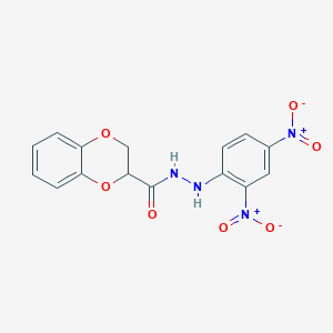 molecular formula C15H12N4O7 B12477523 N'-(2,4-dinitrophenyl)-2,3-dihydro-1,4-benzodioxine-2-carbohydrazide 