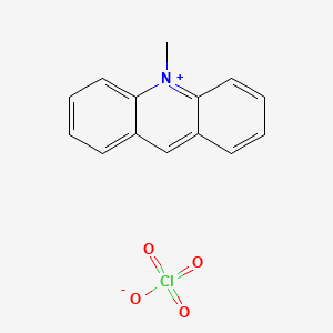 B1247761 10-Methylacridinium Perchlorate CAS No. 26456-05-3