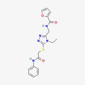 molecular formula C18H19N5O3S B12503089 N-[(4-ethyl-5-{[2-oxo-2-(phenylamino)ethyl]sulfanyl}-4H-1,2,4-triazol-3-yl)methyl]furan-2-carboxamide 