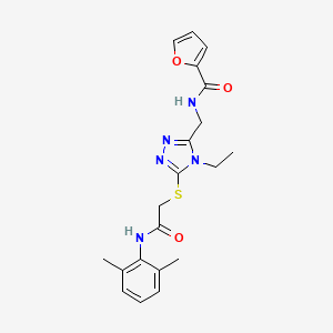 molecular formula C20H23N5O3S B12503365 N-{[5-({2-[(2,6-dimethylphenyl)amino]-2-oxoethyl}sulfanyl)-4-ethyl-4H-1,2,4-triazol-3-yl]methyl}furan-2-carboxamide 