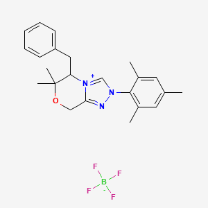 molecular formula C23H28BF4N3O B12503570 5-Benzyl-6,6-dimethyl-2-(2,4,6-trimethylphenyl)-5,8-dihydro-[1,2,4]triazolo[3,4-c][1,4]oxazin-4-ium;tetrafluoroborate 