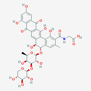 molecular formula C37H37NO19 B125039 2-[[(5S,6S)-5-[(2S,3R,4S,5S,6R)-3,5-dihydroxy-6-methyl-4-[(2S,3R,4S,5R)-3,4,5-trihydroxyoxan-2-yl]oxyoxan-2-yl]oxy-1,6,9,11,14-pentahydroxy-3-methyl-8,13-dioxo-5,6-dihydrobenzo[a]tetracene-2-carbonyl]amino]acetic acid CAS No. 150693-43-9