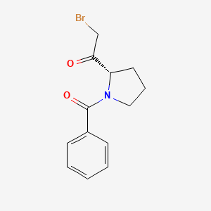 molecular formula C13H14BrNO2 B12579871 1-[(2S)-1-Benzoylpyrrolidin-2-yl]-2-bromoethan-1-one CAS No. 557790-55-3
