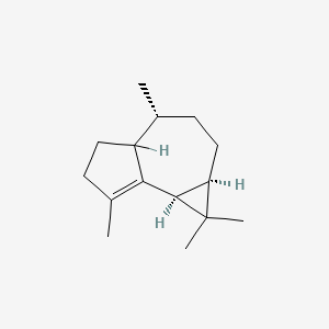 B1258743 (1aR,4R,7bS)-1,1,4,7-tetramethyl-1a,2,3,4,4a,5,6,7b-octahydrocyclopropa[e]azulene CAS No. 489-40-7