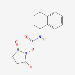 molecular formula C15H16N2O4 B12653953 (2,5-dioxopyrrolidin-1-yl) N-(1,2,3,4-tetrahydronaphthalen-1-yl)carbamate 