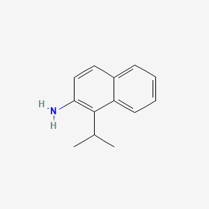 molecular formula C13H15N B12686965 Naphthalene, 1-isopropyl-2-amino- CAS No. 389104-54-5
