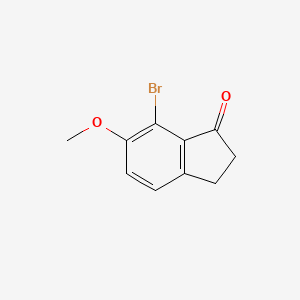 molecular formula C10H9BrO2 B1273434 7-bromo-6-methoxy-2,3-dihydro-1H-inden-1-one CAS No. 892152-26-0