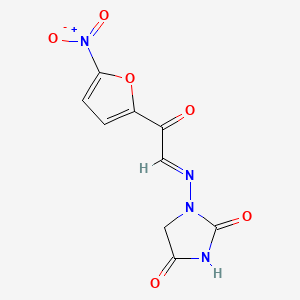molecular formula C9H6N4O6 B12737915 1-(((5-Nitro-2-furoyl)methylene)amino)hydantoin CAS No. 90556-77-7