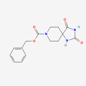 molecular formula C15H17N3O4 B1279388 Benzyl 2,4-dioxo-1,3,8-triazaspiro[4.5]decane-8-carboxylate CAS No. 28121-73-5