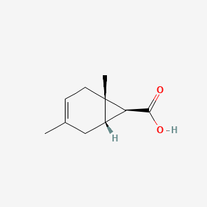 molecular formula C10H14O2 B12805248 (1S,6S,7S)-1,4-Dimethylbicyclo(4.1.0)hept-3-ene-7-carboxylic acid CAS No. 98875-00-4