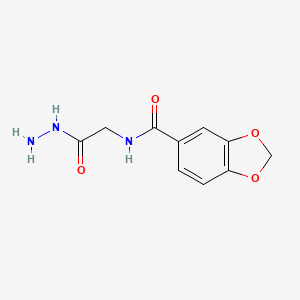 molecular formula C10H11N3O4 B12847163 Benzo[1,3]dioxole-5-carboxylic acid hydrazinocarbonylmethyl-amide 