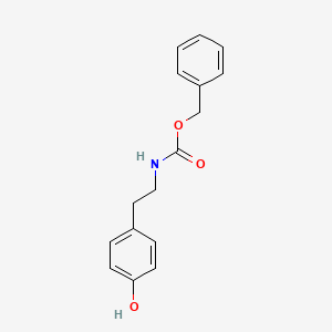 B1286379 benzyl N-[2-(4-hydroxyphenyl)ethyl]carbamate CAS No. 29655-46-7