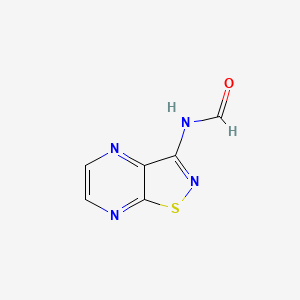 molecular formula C6H4N4OS B12900668 N-[1,2]Thiazolo[4,5-b]pyrazin-3-ylformamide CAS No. 92914-69-7