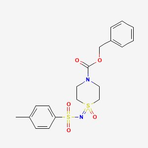 molecular formula C19H22N2O5S2 B12923839 Benzyl 1-(tosylimino)-1l6-thiomorpholine-4-carboxylate 1-oxide 