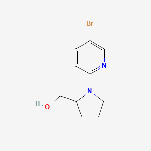 molecular formula C10H13BrN2O B12974112 (1-(5-Bromopyridin-2-yl)pyrrolidin-2-yl)methanol 