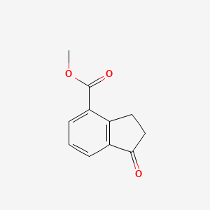 B1311759 Methyl 1-oxo-2,3-dihydro-1H-indene-4-carboxylate CAS No. 55934-10-6