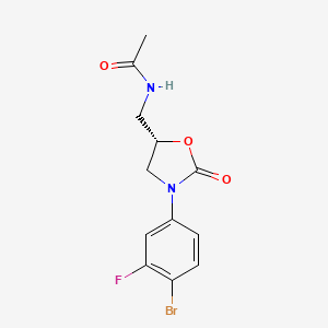 molecular formula C12H12BrFN2O3 B1312918 (5S)-N-[3-(4-Bromo-3-fluorophenyl)-2-oxooxazolidin-5-ylmethyl]acetamide CAS No. 856677-05-9
