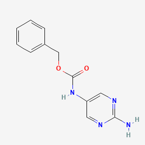 molecular formula C12H12N4O2 B13139531 Benzyl (2-aminopyrimidin-5-yl)carbamate 