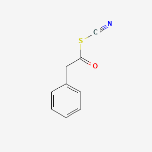 molecular formula C9H7NOS B13149243 Benzeneethanethioicacid,anhydrosulfidewiththiocyanicacid 