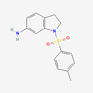 molecular formula C15H16N2O2S B1317406 1-[(4-Methylphenyl)sulfonyl]indolin-6-amine CAS No. 927997-18-0