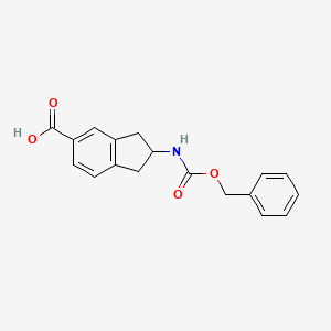 molecular formula C18H17NO4 B13180770 2-{[(benzyloxy)carbonyl]amino}-2,3-dihydro-1H-indene-5-carboxylic acid 